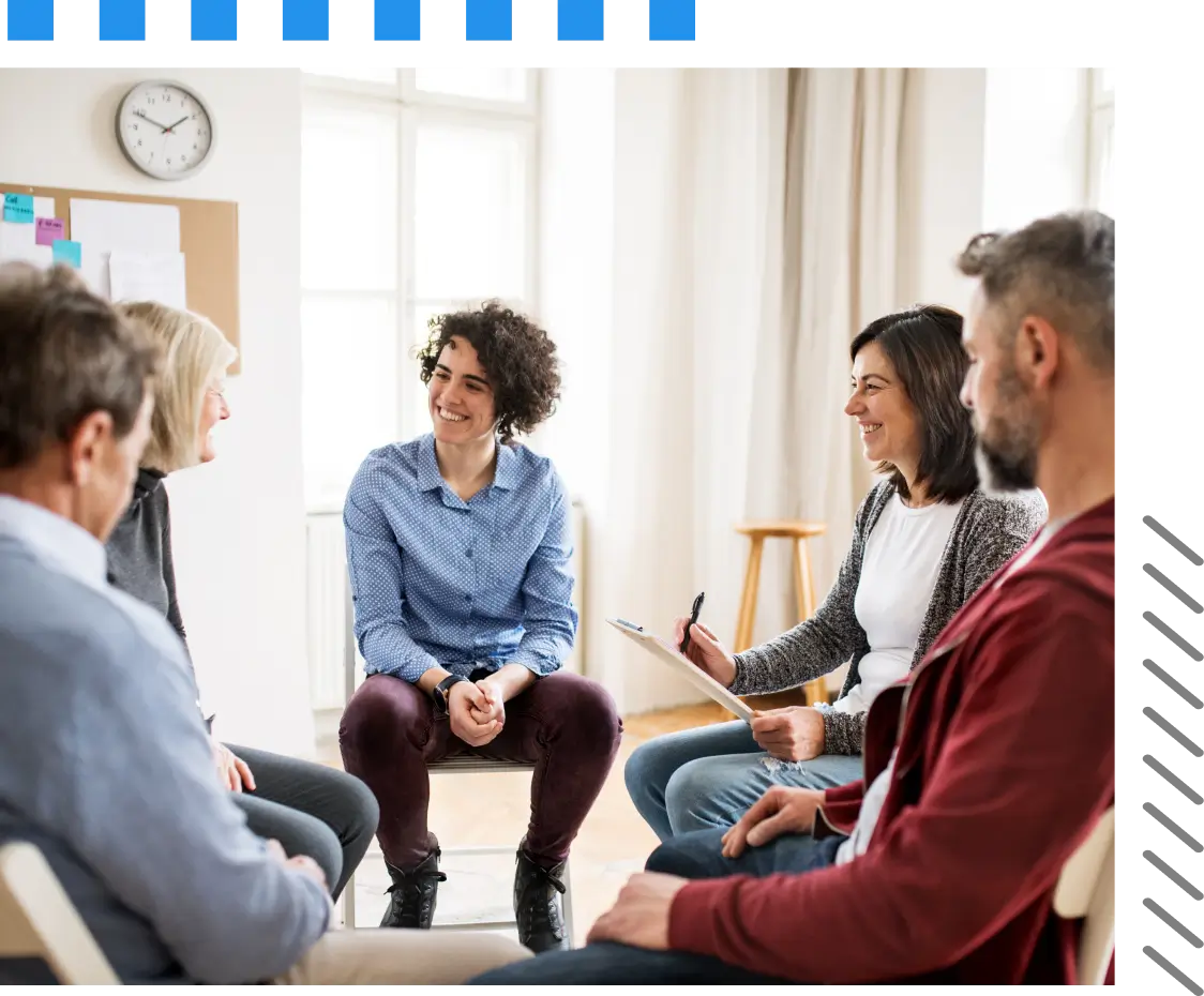 A group of people sitting in a circle.